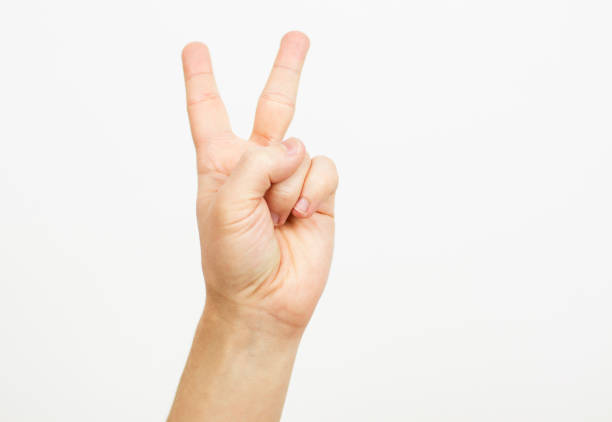 istock man hand victory sign gesture isolated on white background 1226278195