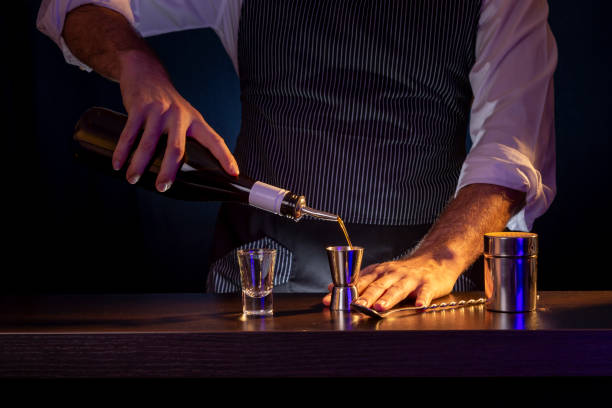 istock Bartender pouring cocktail ingredient into measuring cup 1226279908