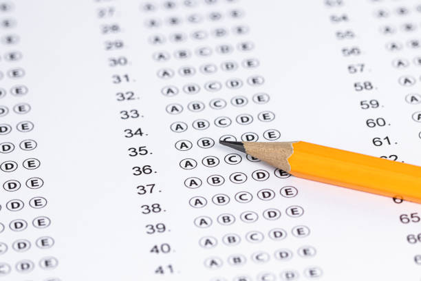 istock Answer sheet form with pencil on table, close up. Concept of passing exam 1226282370