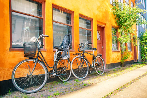 istock Old yellow house of Nyboder district with bicycles. Old Medieval district in Copenhagen, Denmark. Summer sunny day 1226283100