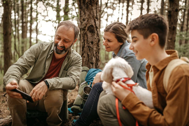 istock Family using mobile phone on hiking tour 1226284210