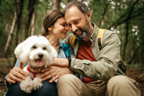 istock Loving couple with pet dog in forest 1226284323