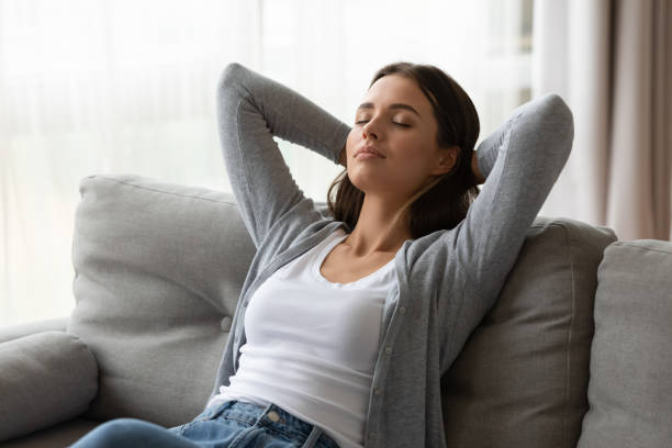 istock Millennial girl relax on sofa sleeping or daydreaming 1226286162