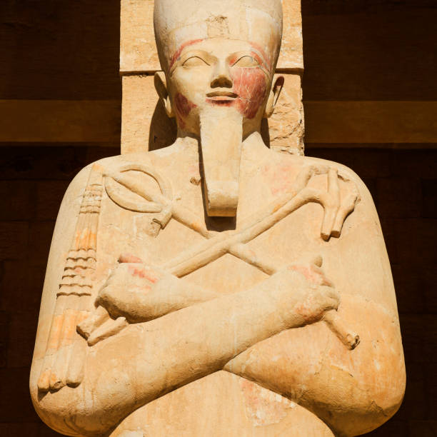 Statue of Osiris at the Mortuary Temple of Hatshepsut in Deir el-Bahari, Egypt Statue of Osiris at the Mortuary Temple of Hatshepsut in Deir el-Bahari, Egypt. hatshepsut photos stock pictures, royalty-free photos & images