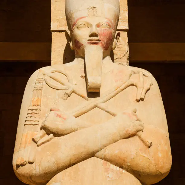 Statue of Osiris at the Mortuary Temple of Hatshepsut in Deir el-Bahari, Egypt.