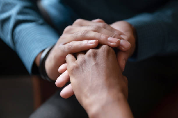 istock Multiethnic couple hold hands sharing close intimate moment together 1226288593