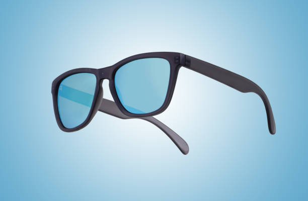 Black framed sunglasses with blue lenses on a blue and white graduated background