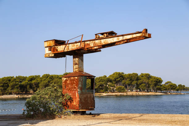 Old port crane rusts in the sun