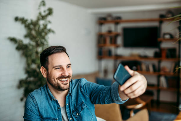 istock Handsome man taking a selfie on smart phone. 1226295259