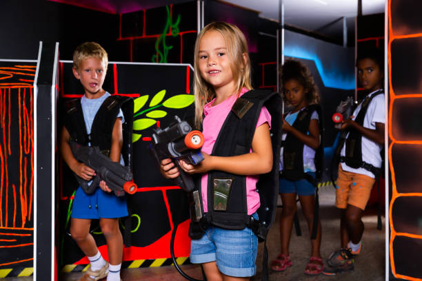 istock Happy tweenager girl with laser gun 1226296185