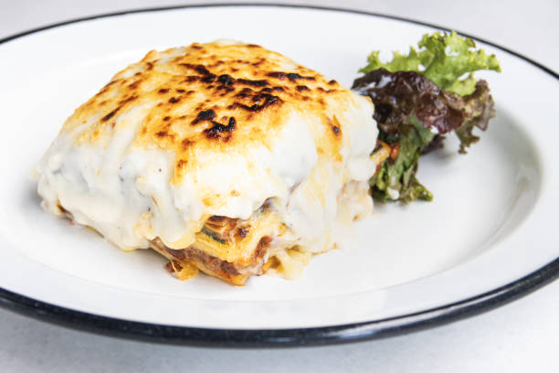 istock Homemade Lasagna gratin portion isolated from the white background. 1226298043