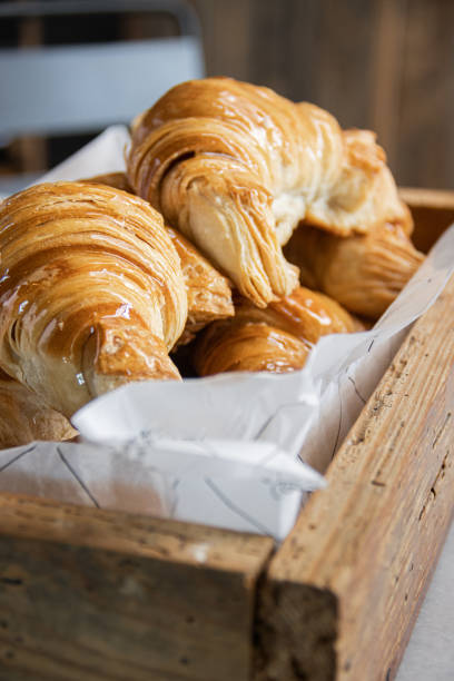 istock Fresh Baked Croissants in a wooden box. 1226298064