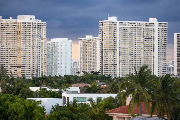 This is a photograph of residential high rise apartment buildings with dark tropical storm clouds in Aventura, Florida at the beginning of hurricane season.