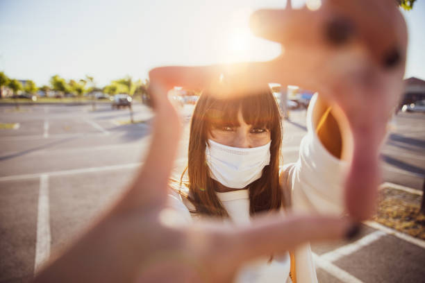 istock Woman smiling behind the protective mask 1226301090