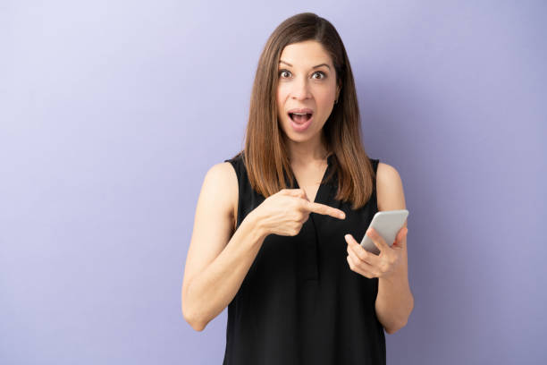 istock Looking surprised at her smartphone 1226303954