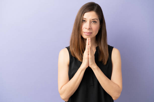 istock Woman making a plea with hands together 1226303991