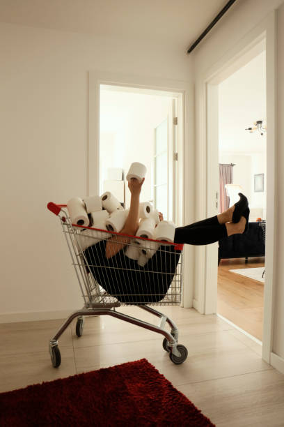 istock Shoping cart filled with toilet paper 1226309452