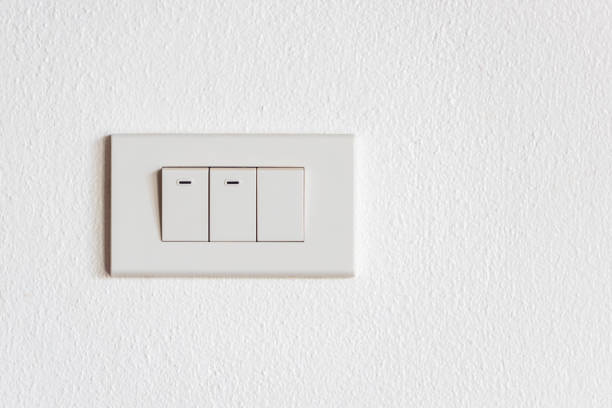 istock Switch for turning on and lighting the house which is installed on the white wall 1226310642