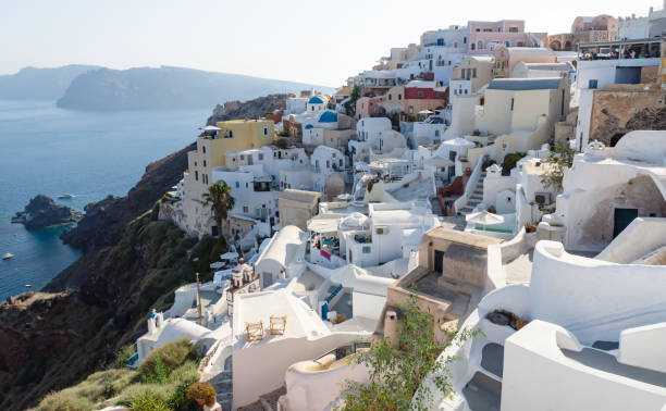istock Greek village on volcanic cliffs along ocean, Oia, Santorini, Greece 1226312844