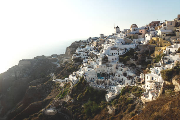 istock View on Greek village with wind mill with backlight, Oia, Santorini, Greece 1226312846