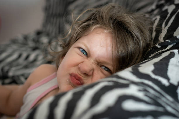 istock little girl on the couch 1226314335