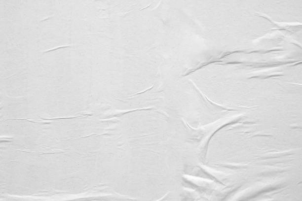 istock Blank white crumpled and creased paper poster texture background 1226317891