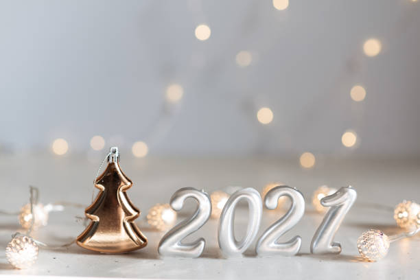 istock New Year 2021 silver balloons with fireworks 1226318191