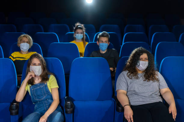istock COVID-19 new normality. Audience in cinema. 1226318231