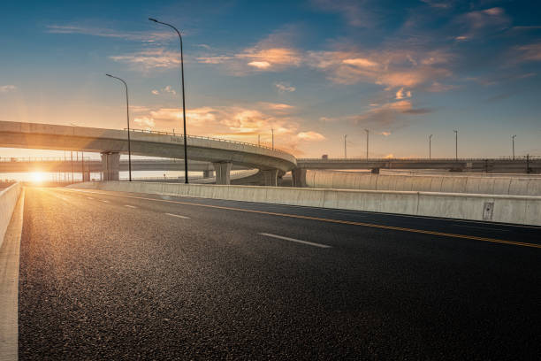 istock Dusk colored clouds in the background, highway overpass curved approach bridge 1226321974