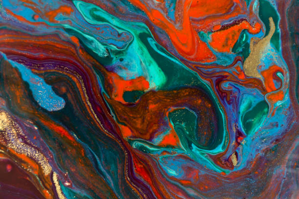 istock Mixed colorful inks background. Abstract paint texture with golden glitter. 1226324282