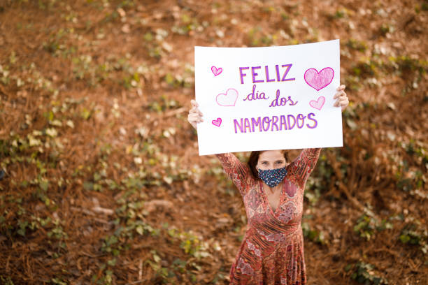 Woman holding a valentine's day poster.