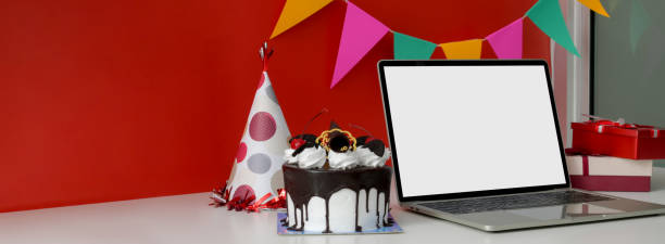 istock Online Birthday celebration concept with blank screen laptop, cake and decorations 1226325783