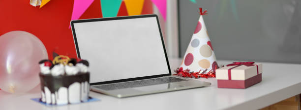 istock Online Birthday celebration concept with blank screen laptop, cake and decorations 1226325787