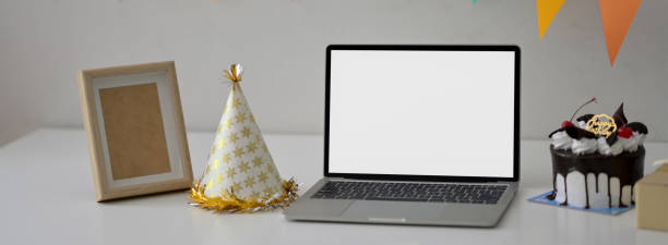 istock Online party concept with blank screen laptop, party hat and mock-up frame 1226325800