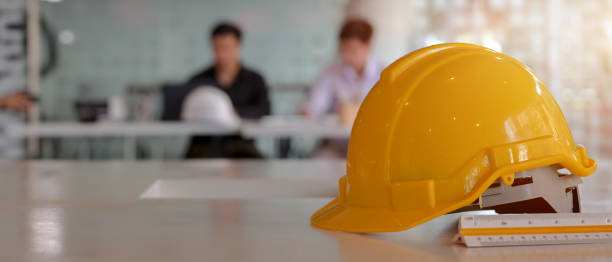 istock Close up view of engineer worktable with safety helmet, copy space and measuring tool 1226325802