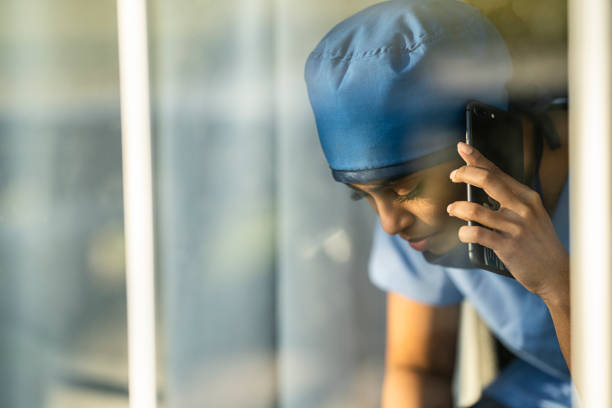 istock Female medical professional looking out window 1226327426