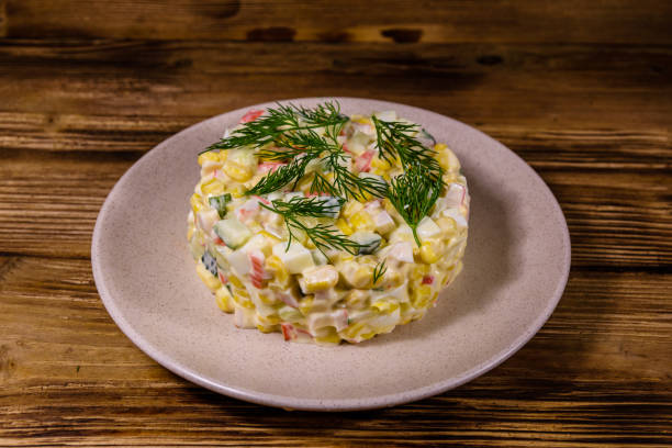 istock Salad with crab sticks, boiled eggs and cucumbers on a ceramic plate 1226329174