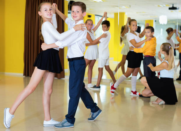 istock Little boys and girls having dancing class in classroom 1226332645