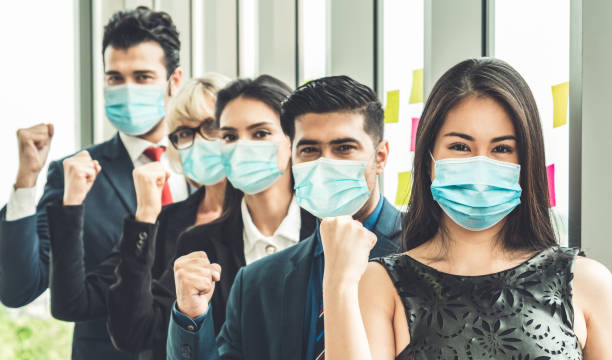 istock Confident business people with face mask protect from Coronavirus or COVID-19. 1226332680