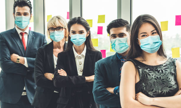 istock Confident business people with face mask protect from Coronavirus or COVID-19. 1226332686