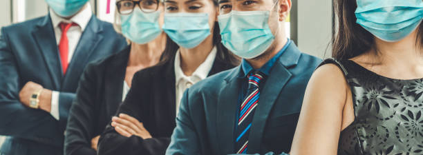 istock Confident business people with face mask protect from Coronavirus or COVID-19. 1226332712