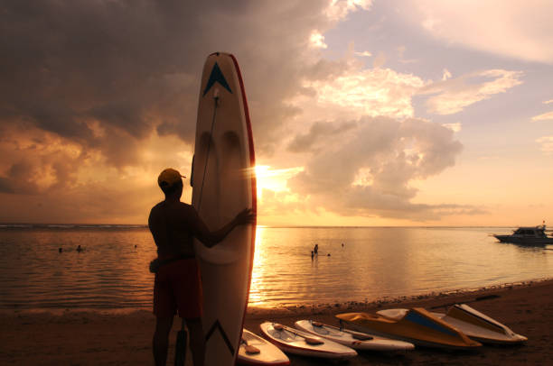 istock Silhouette of surfboards on beach 1226333814