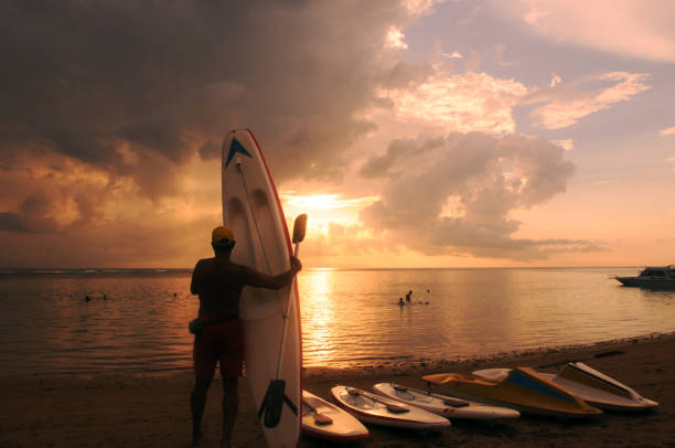 istock Silhouette of surfboards on beach 1226333815