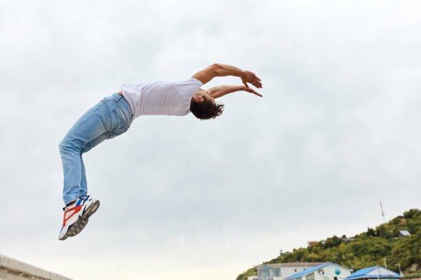 istock brave guy in white T-shirt and jeans bending his back 1226338683