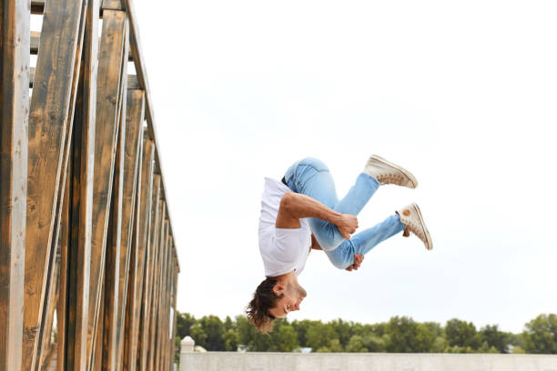 istock young man in comfortable stylish casual clothes doing crazy stunts 1226339312