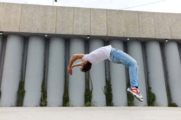 istock brave strong man jumping in the street 1226339565
