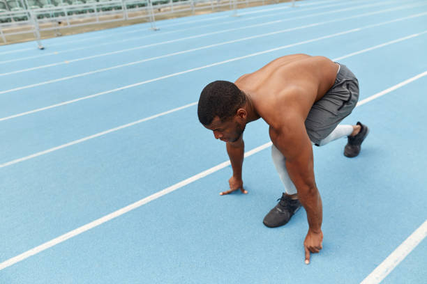 istock sporty ambitious guy doing exercises for legs 1226339575