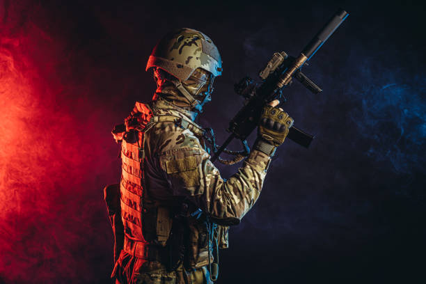 istock warrior man in military uniform in smoky background with UV rays 1226340433