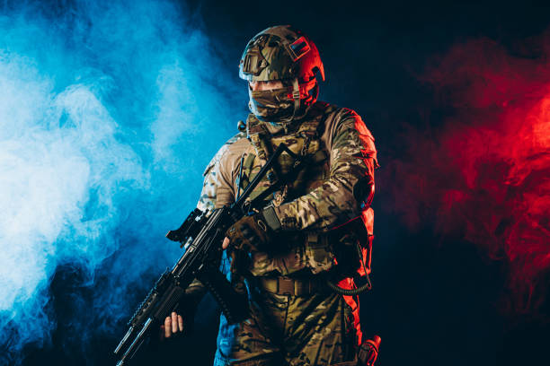 istock warrior man in military uniform in smoky background with UV rays 1226340452