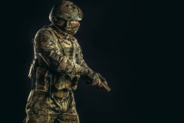 istock young soldier man holding gun 1226340987
